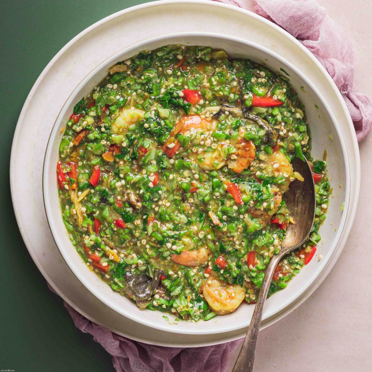 Top view of traditional Nigerian Okro Soup with seafood and vegetables